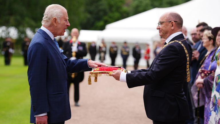 King Charles III receives the keys to the City of Edinburgh from Lord Provost Councillor Robert Aldridge as he takes part in the Ceremony of the Keys on the forecourt of the Palace of Holyroodhouse in Edinburgh, which is part of his trip to Scotland for Holyrood Week. Picture date: Tuesday July 2, 2024.