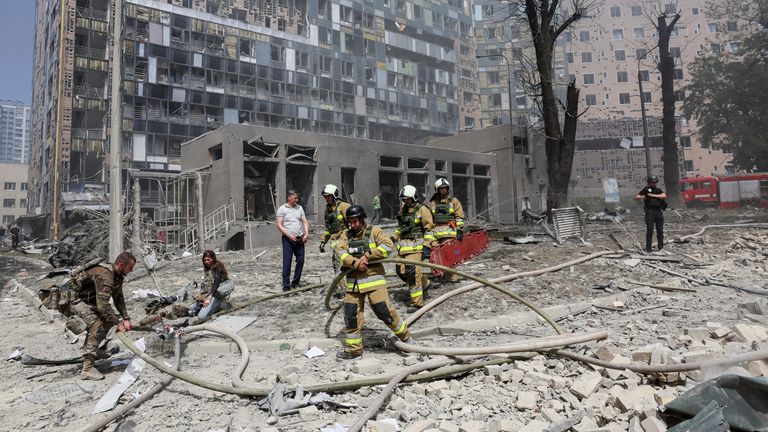 Rescuers work at a site of a building damaged during a Russian missile strikes, amid Russia's attack on Ukraine, in Kyiv, Ukraine July 8, 2024. REUTERS/Gleb Garanich