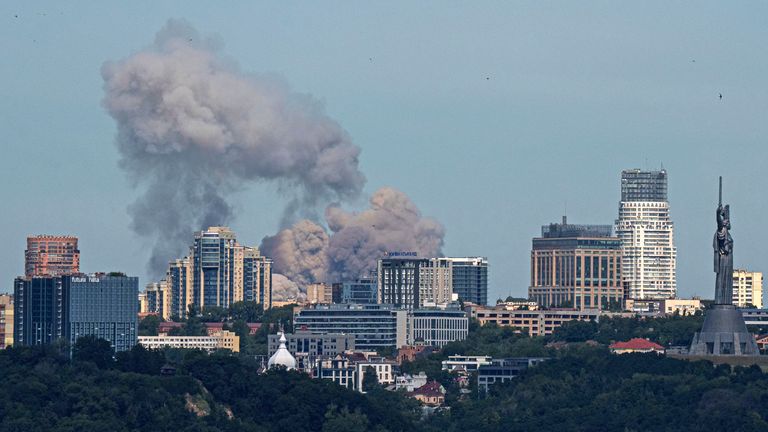 Smoke rises over the Kyiv skyline after a Russian attack, Monday, July 8, 2024. Russian forces launched multiple ballistic and cruise missiles against Ukrainian targets on Monday, Ukraine...s air force said, with explosions felt and heard across the capital, Kyiv. (AP Photo/ Evgeniy Maloletka)