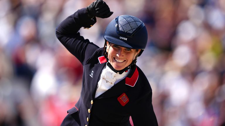 Laura Collett aboard London 52 celebrates winning a bronze medal