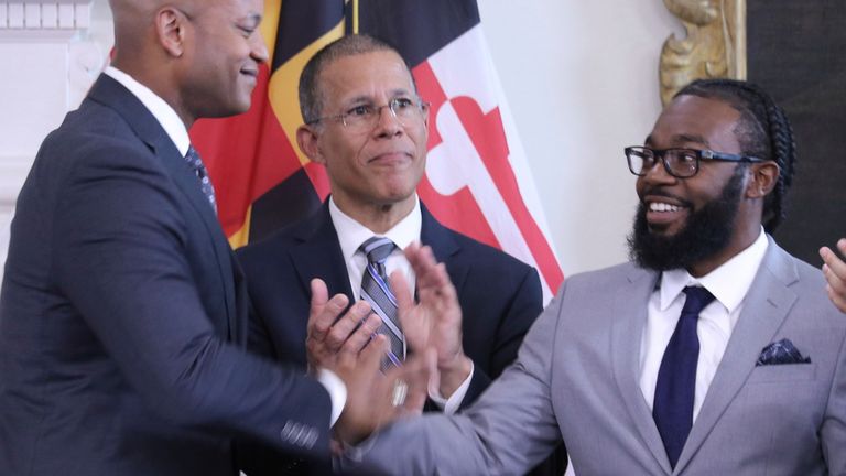 Shiloh Jordan (right) receives a pardon for a marijuana misdemeanor conviction from Maryland governor Wes Moore in June. Pic: Reuters