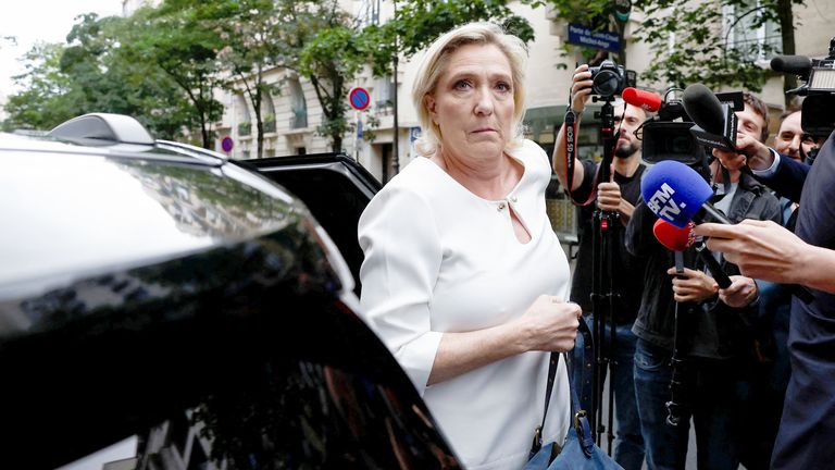 Marine Le Pen arrives at the RN party headquarters in Paris.
Pic:Reuters