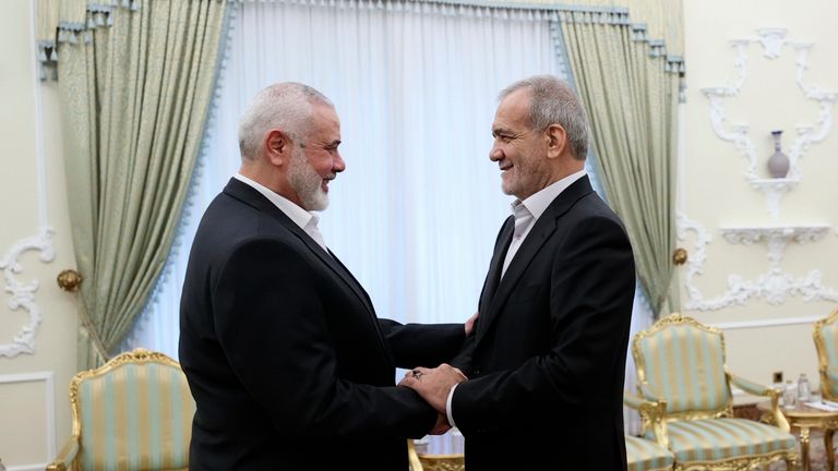 Haniyeh shakes hands with Iran's new president, Masoud Pezeshkian. Pic: AP