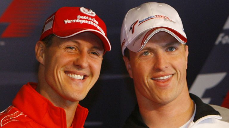 Ferrari's Michael Schumacher (L) of Germany and his brother Toyota's driver Ralf Schumacher exchange a handshake before a news conference at the Nuerburgring racing circuit in western Germany May 4, 2006. Sunday's European Grand Prix at the Nuerburgring is the home race of the two Schumachers, the closest circuit to their childhoodhood home in Kerpen. REUTERS/Wolfgang Rattay