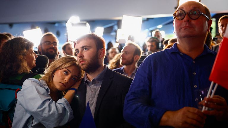 Supporters of the French far-right Rassemblement National (National Rally - RN) party react after partial results in the second round of the early French parliamentary elections, at the RN in Paris, France, July 7, 2024. REUTERS/Sarah Meyssonnier