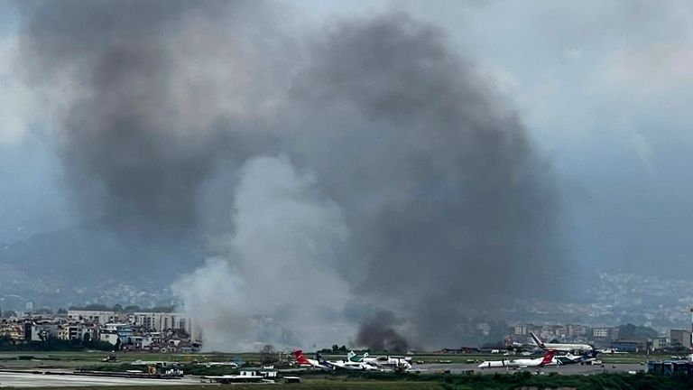 Smoke rises from the Tribhuvan International Airport in Kathmandu, Nepal. Pic: AP