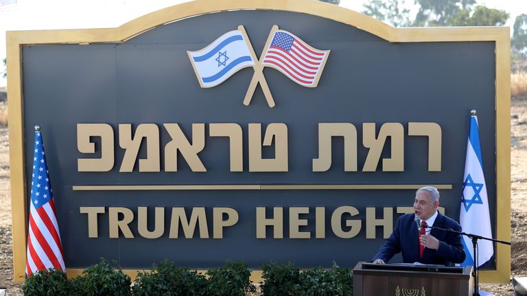 Israeli Prime Minister Benjamin Netanyahu speaks during a ceremony to unveil a sign for a new community named after then US president, Donald Trump, in June 2019. Pic: Reuters