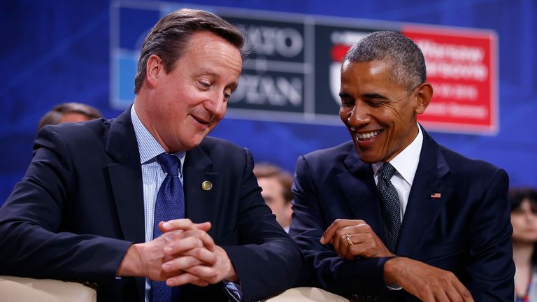 U.S. President Barack Obama speaks to British Prime Minister David Cameron during the NATO Summit in Warsaw, Poland July 8, 2016. REUTERS/Kacper Pempel