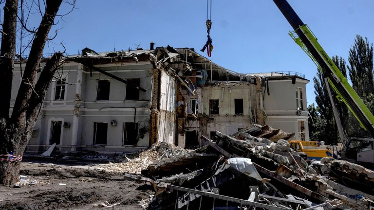 A emergency service worker is suspended above the blast site following a Russian missile strike on the Okhmatdyt Children's Hospital, amid Russia's attack on Ukraine, in Kyiv, Ukraine July 9, 2024. REUTERS/Thomas Peter