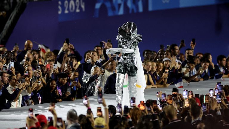 The Olympic flag is carried on the  Trocadero during the opening ceremony.
Pic: Reuters