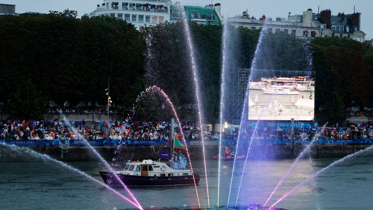 A water display is seen on a floating platform along the River Seine.
Pic: AP