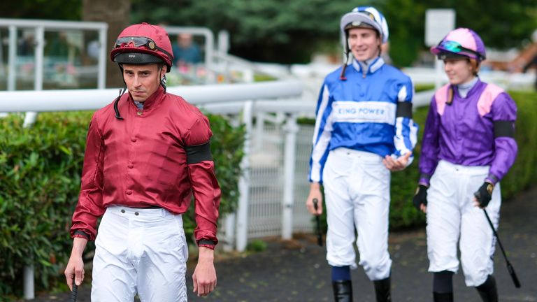 Jockeys wear black armbands.
Pic: Gett Images