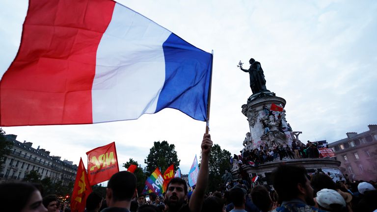 People gather in Paris following the second round of the legislative elections. Pic: AP