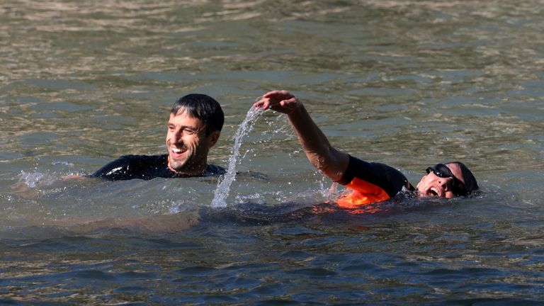 Paris mayor Anne Hidalgo and Tony Estanguet, President of the Paris 2024 Olympic and Paralympic Games Organising Committee in the water. Pic: AP