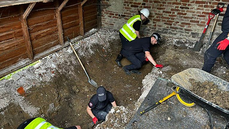 Police officers searching inside a barn at a Hertfordshire farm for the remains of Muriel McKay.
Pic: Met Police/PA