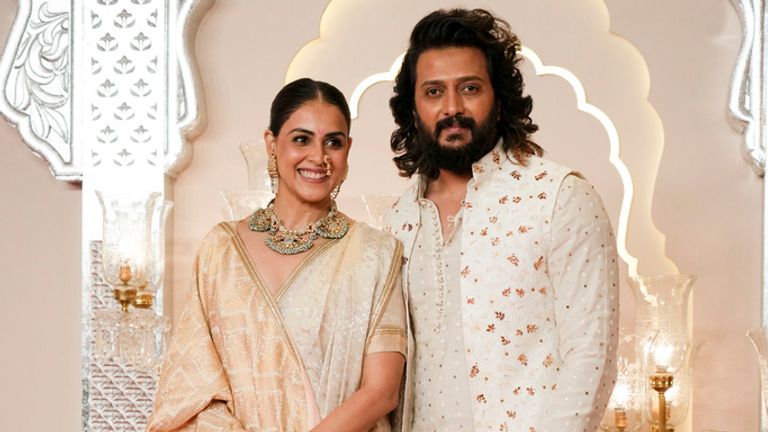 Bollywood actor Riteish Deshmukh poses for a photograph with his wife Genelia.
Pic: AP