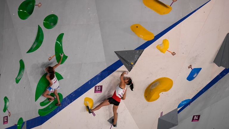 Italian Laura Rogora (left) and Canadian Alannah Yip (right) climb during bouldering qualification portion at 2020 Olympics. Pic: AP