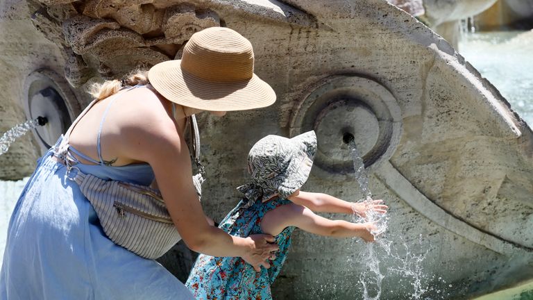 Cooling down at the Spanish Steps in Rome. Pic: Cecilia Fabiano/LaPresse via AP