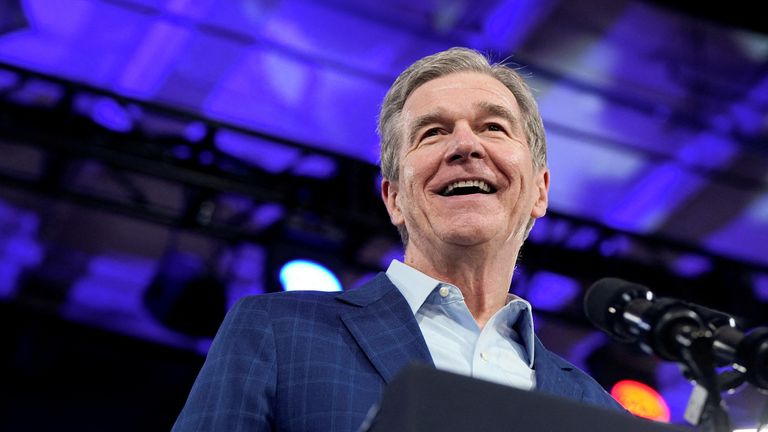 North Carolina Governor Roy Cooper smiles as he attends U.S. President Joe Biden's rally in Raleigh, North Carolina.
Pic: Reuters