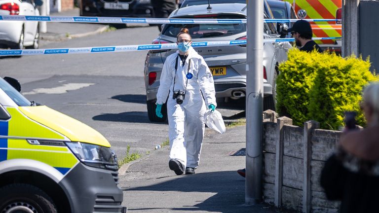 A police scenes of crime officer works at the scene in Southport.
Pic: PA