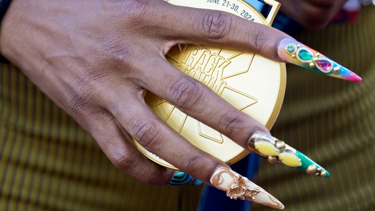 Sha'Carri Richardson's nails cover gold medal at US Track and Field Olympic Team Trials in June. Pic: AP