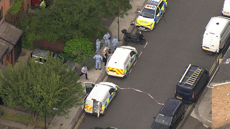 Police and forensics officers at the scene in Shepherd's Bush