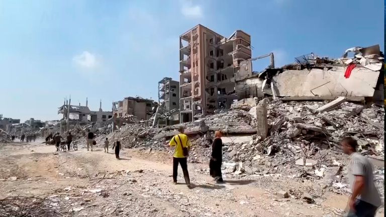 Palestinians return to scenes of destruction in Gaza City's Shuja'iyyah neighborhood on 11 July. Pic: AP Photo