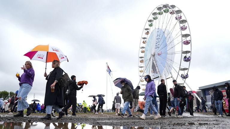 Fans shelter from the rain during practice 3 of the British Grand Prix at Silverstone Circuit, Northamptonshire. Picture date: Saturday July 6, 2024.