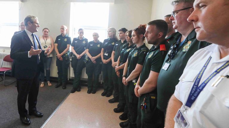 Sir Keir Starmer speaks to emergency personnel during a visit to Southport. Pic: PA