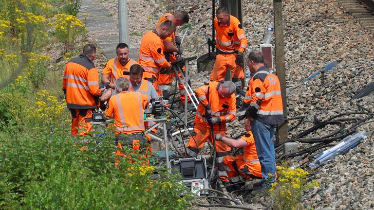 SNCF railway workers work at the site where vandals targeted France&#39;s high-speed train network.
Pic: Reuters