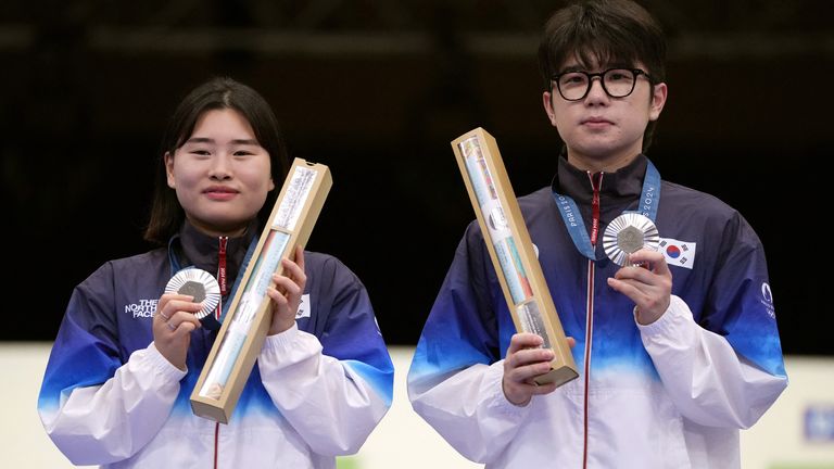 South Korea's Jihyeon Keum (left) nad Hajun Park with their silver medals from the 10m mixed air rifle competition. Pic: Reuters