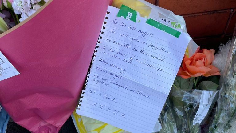 A note left with flowers at the scene