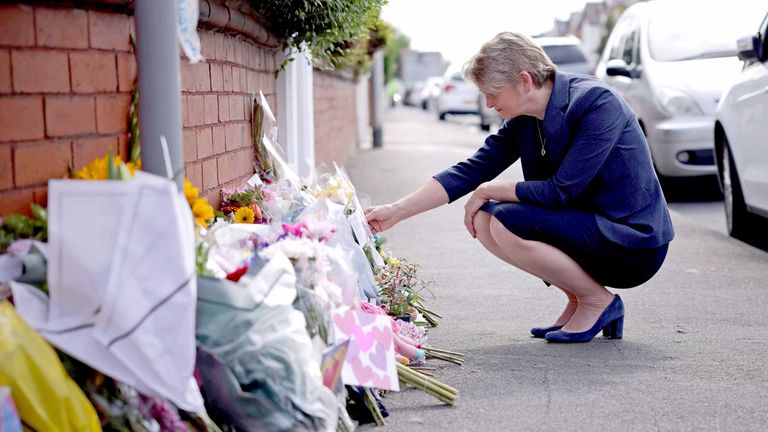 Yvette Cooper looks at tributes near the scene in Hart Street, Southport.
Pic: PA
