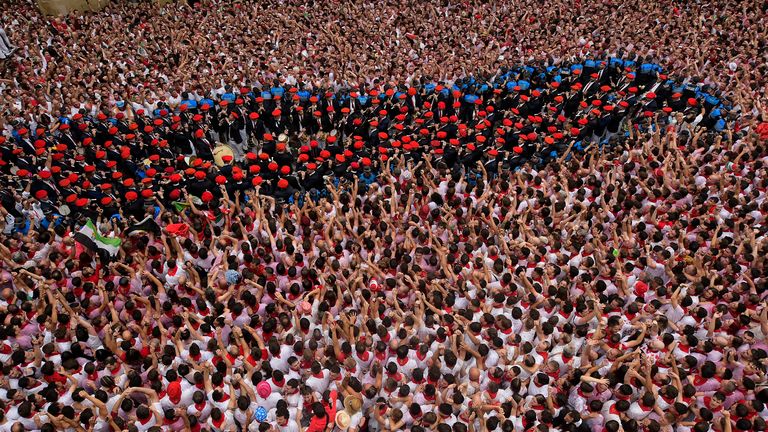 A music band makes it's way through the crowd ahead of the festival. Pic: AP