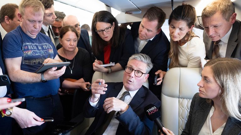 Sir Keir Starmer talks to journalists on the flight to Washington Pic: AP