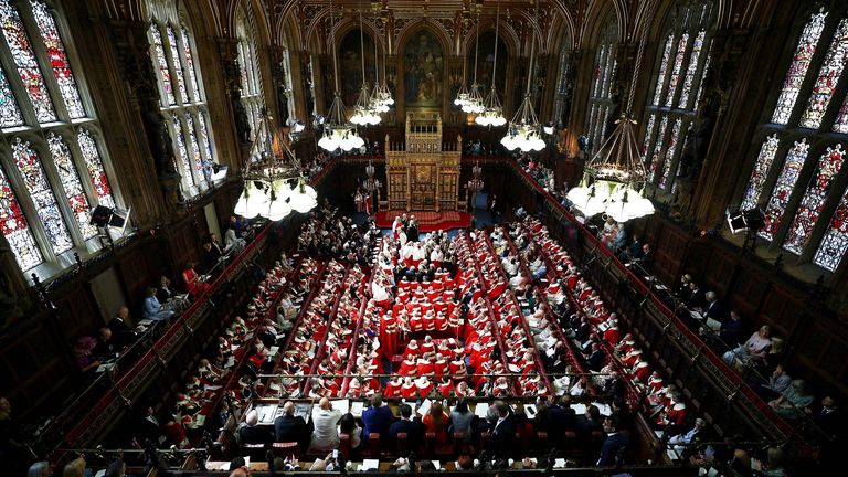 Members of the House of Lords and guests take their seats in the Lords Chamber.
Pic: Reuters