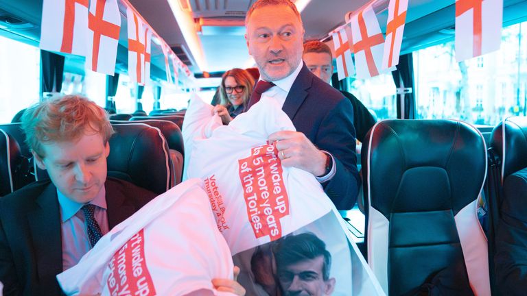Shadow environment secretary Steve Reed hands out pillows to journalists, printed with a mocked-up photo of Rishi Sunak in bed and the words "Don't wake up to five more years of the Tories." 
Pic: PA