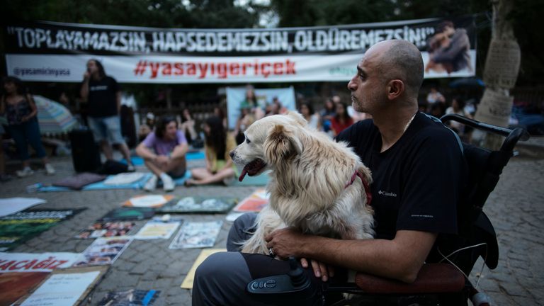 The banner at one protest reads: 'You cannot collect, imprison and kill! #withdraw the legislation.' Pic: AP 