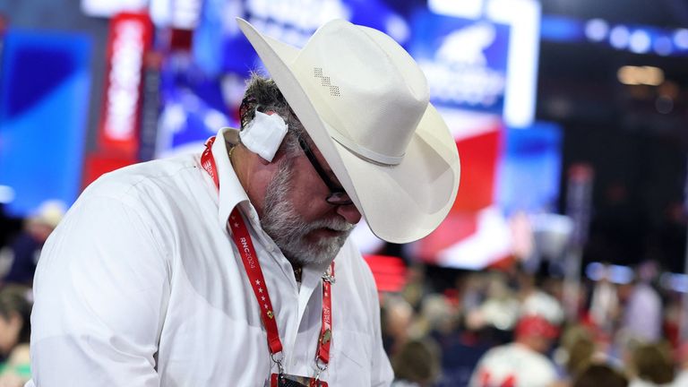 An Arizona delegate wears a bandage in reference to the injury suffered by Republican presidential nominee and former U.S. President Donald Trump in the assassination attempt on Day 3 of the Republican National Convention (RNC), at the Fiserv Forum in Milwaukee, Wisconsin, U.S., July 17, 2024. REUTERS/Andrew Kelly
