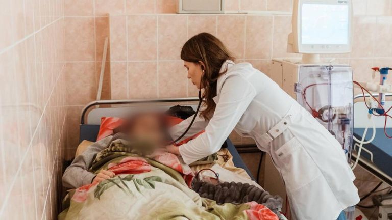 Svitlana Lukyanchuk treats a child at the Okhmatdyt Children's Hospital 