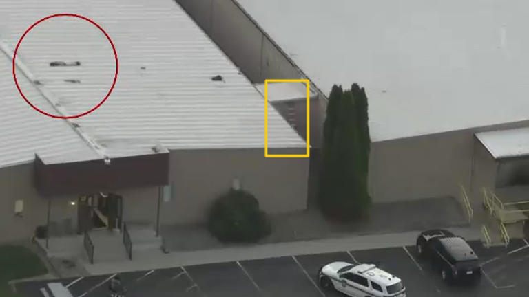 Gunman pictured on roof (left) and a ladder visible in aerial imagery of the building. Pic: AP