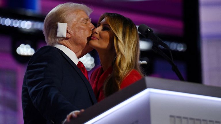 Republican presidential nominee and former U.S. President Donald Trump is joined on stage by his wife Melania after he finished giving his acceptance speech on Day 4 of the Republican National Convention (RNC), at the Fiserv Forum in Milwaukee, Wisconsin, U.S., July 18, 2024. REUTERS/Callaghan O'hare TPX IMAGES OF THE DAY