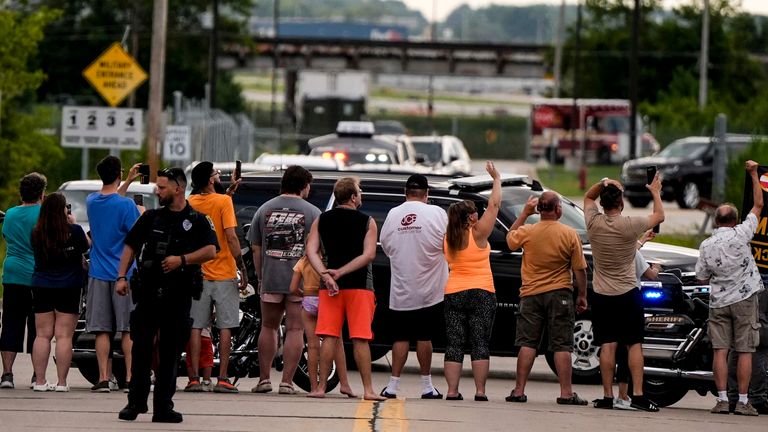 Supporters wave at Trump's motorcade. Pic: AP
