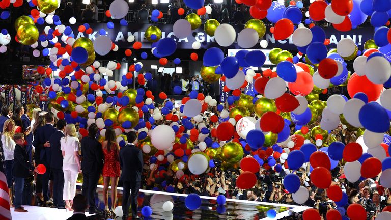 Republican presidential nominee and former U.S. President Donald Trump and his family face the crowd as balloons fall following his speech on Day 4 of the Republican National Convention (RNC), at the Fiserv Forum in Milwaukee, Wisconsin, U.S., July 18, 2024. REUTERS/Brian Snyder