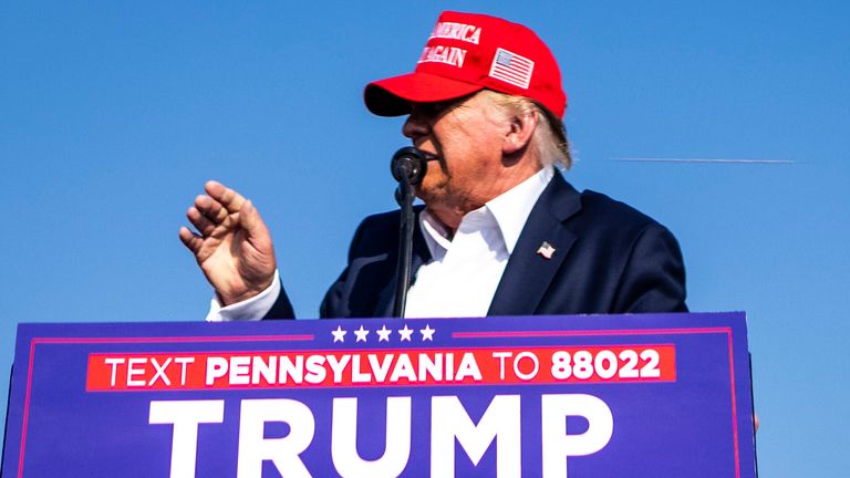 A bullet can be seen in this image flying past Mr Trump's head. Pic: Doug Mills/The New York Times/Redux/eyevine