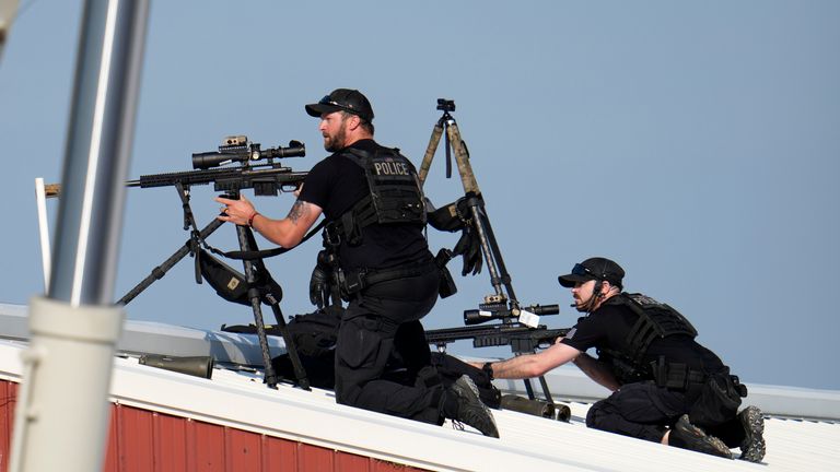 Police snipers return fire after shots were fired at Donald Trump's rally. Pic: AP