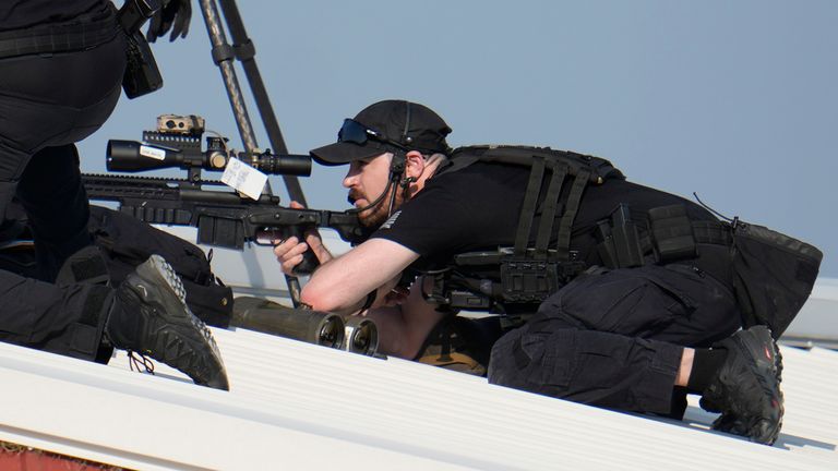 Police snipers return fire after shots were at Trump. Pic: AP