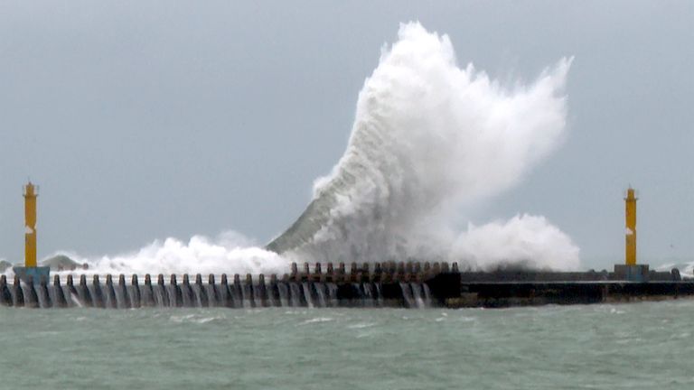 CORRECTS MONTH - Waves crash onto the coastline before typhoon Gaemi makes landfall in northeastern Taiwan's Yilan county on Wednesday, July 24, 2024. Taiwan has shuttered offices, schools and tourist sites across the island ahead of a powerful typhoon due to make landfall later Wednesday. (AP Photo/Johnson Lai)