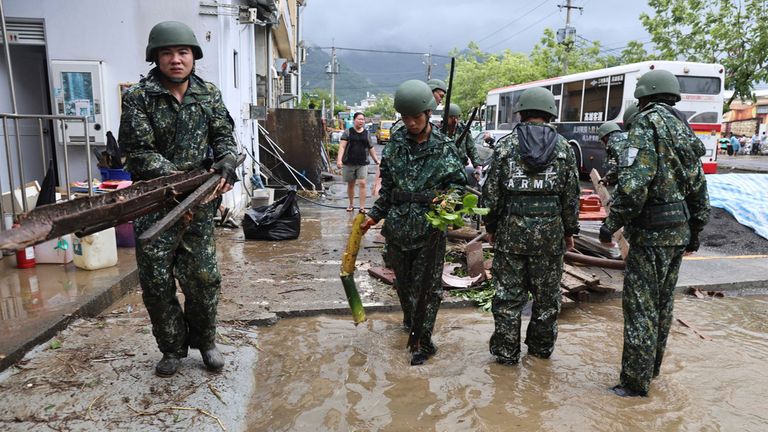 Taiwanese soldiers clear debris in the aftermath of Typhoon Gaemi in Kaohsiung county on Friday. Pic: AP