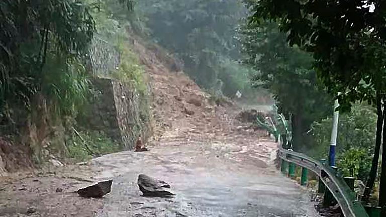 Landslide blocks a road in Shoyue Town, Hengyang, Hunan province, China on Sunday. Pic: AP